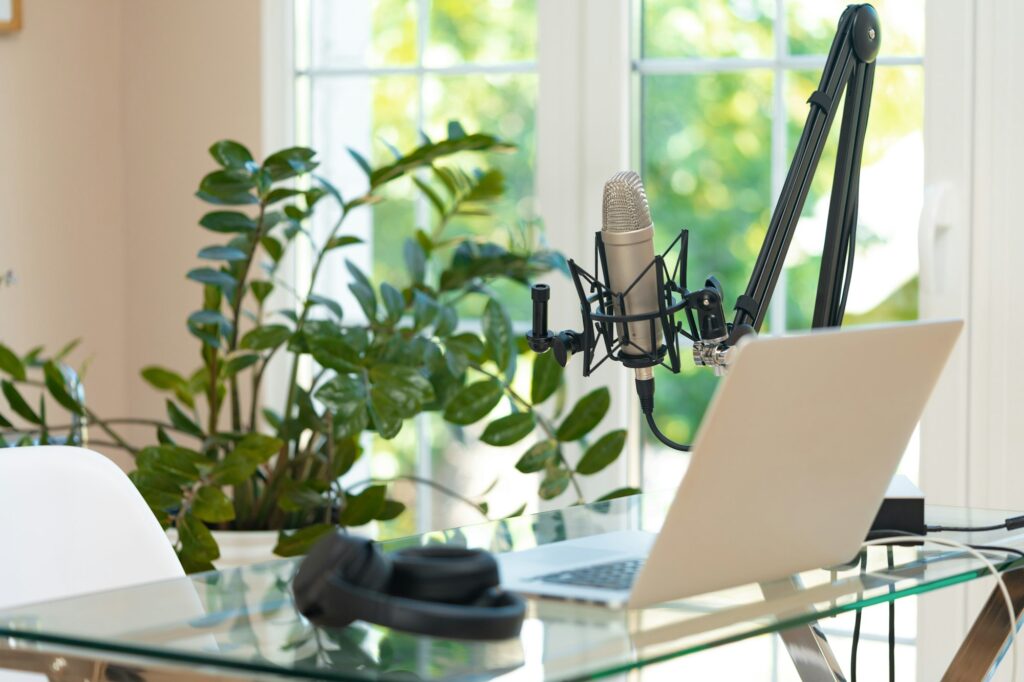 Home studio podcast interior with microphoneand laptop